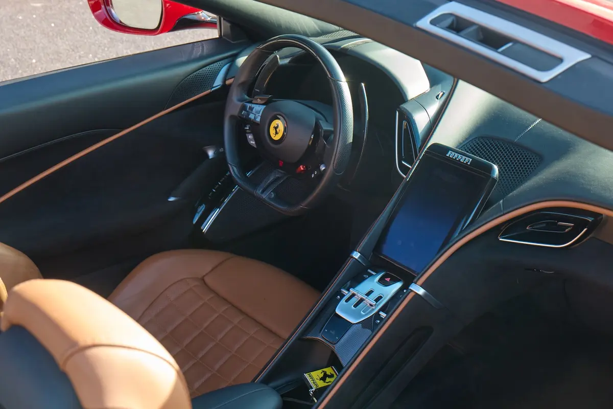 Ferrari Roma Spider 2024, rear view — Florence Luxury Car Rental, Florence. Ferrari Roma Spider in Florence The 2024 Ferrari Roma Spider is available for rental in…