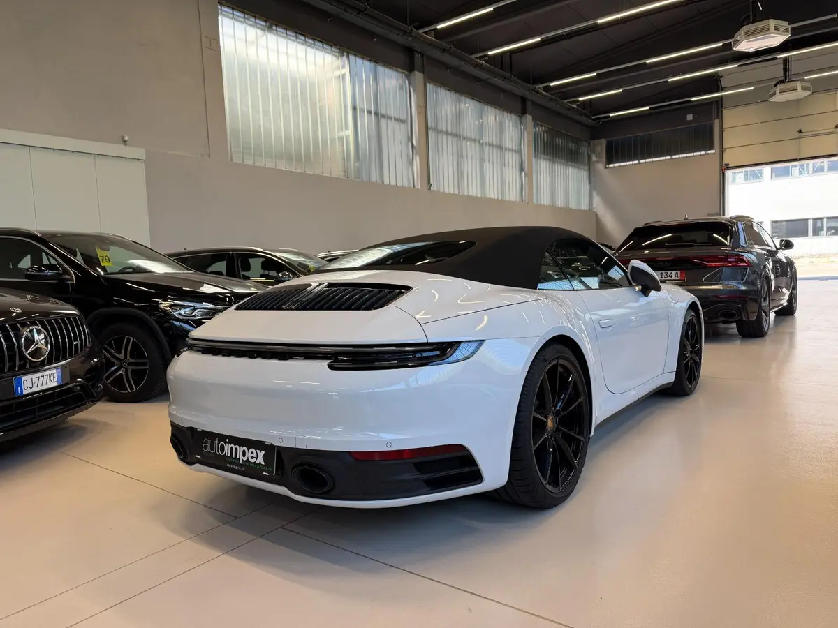Porsche 911 Carrera S Cabrio (992) 2025, side profile — Florence Luxury Car Rental, Florence. Porsche 911 Carrera S Cabrio (992) in Florence Renting the 2025 Porsche 911 Carrera S…